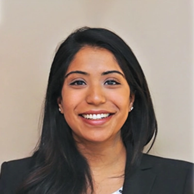 Pediatric Dentist Ashley Abraham Chacko Smiling In Blazer