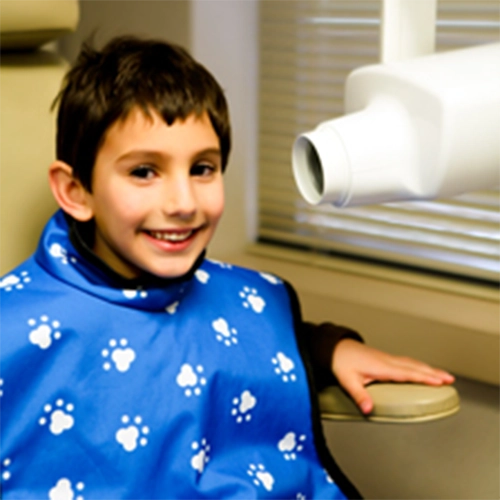 Pediatric Dentist Grosse Pointe Woods MI Child Sitting At X-Ray Machine HP Happy Child Sitting At X-Ray Machine