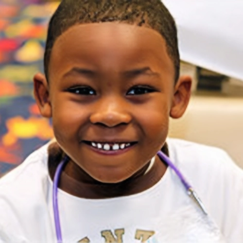 Pediatric Dentist Grosse Pointe Woods MI Child With Toothy Smile HP Child With Toothy Smile At The Dentist