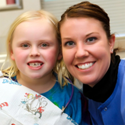 Pediatric Dentist Grosse Pointe Woods MI Kelly With Happy Patient HP Registered Dental Hygienist Kelly With Happy Patient